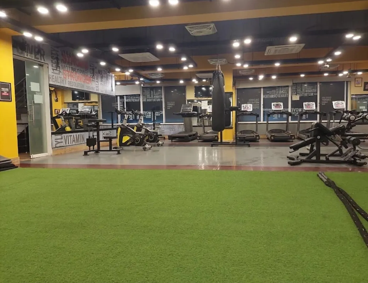 Burnout Fitness Club, Valencia Town — turf zone and cardio deck